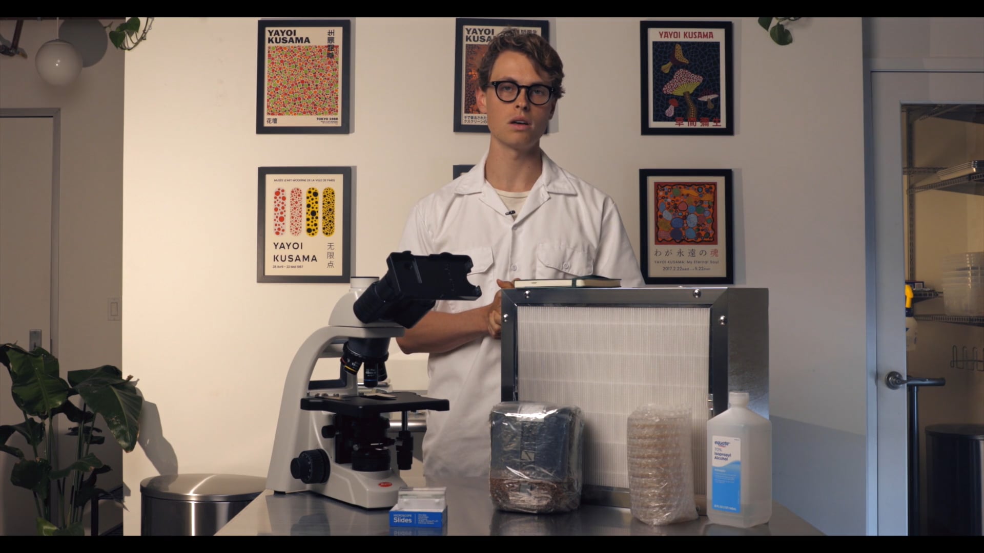 Jim Cubensis standing in front of mycology equipment